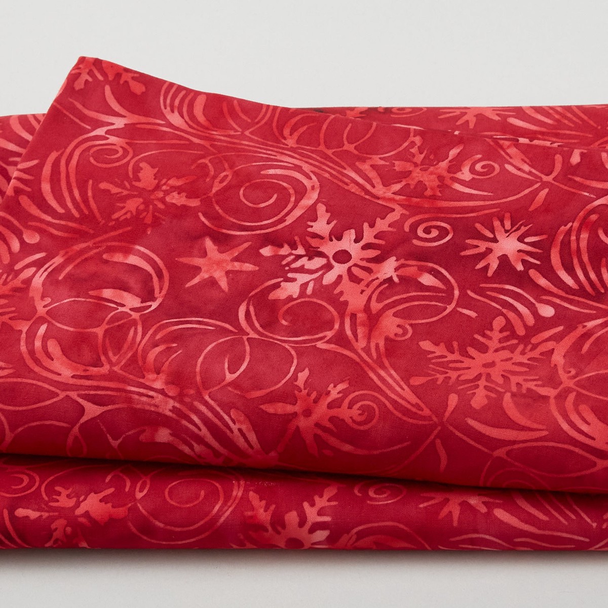 winter-wonders-batiks-snowflake-swirls-paprika-2-yard-cut