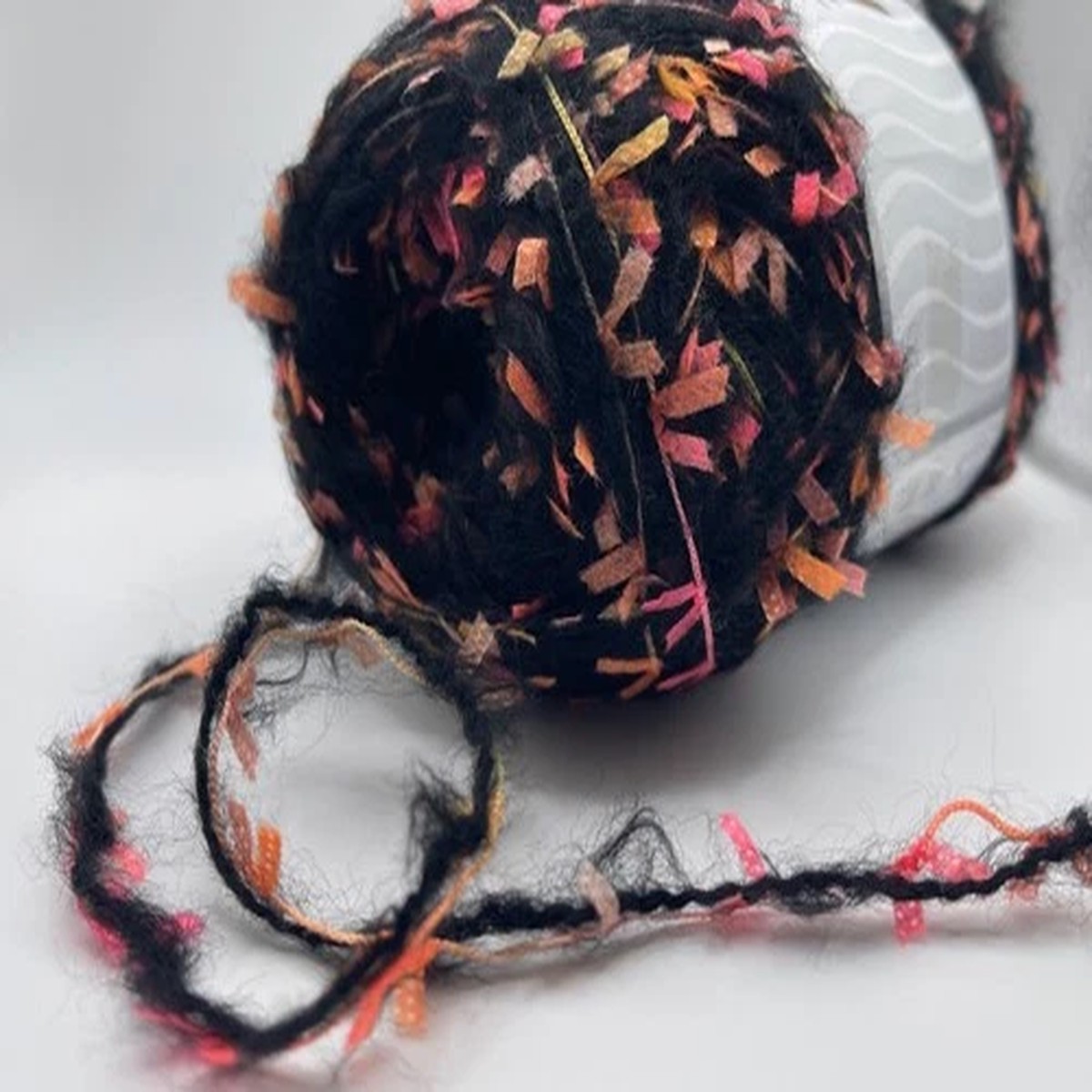halloween-fantasy-yarn-ice-70245-ice-yarns-black-w-orange-pink-flags-100g-164yd