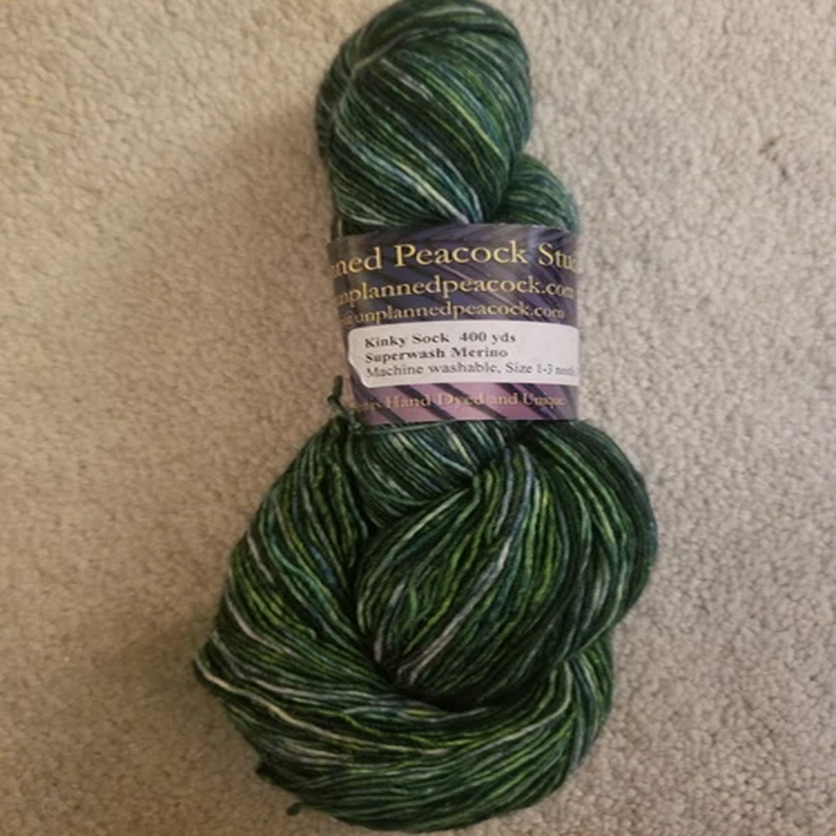 unplanned-peacock-kinky-sock-yarn-100-sw-merino-wool-approx-400-yards-green