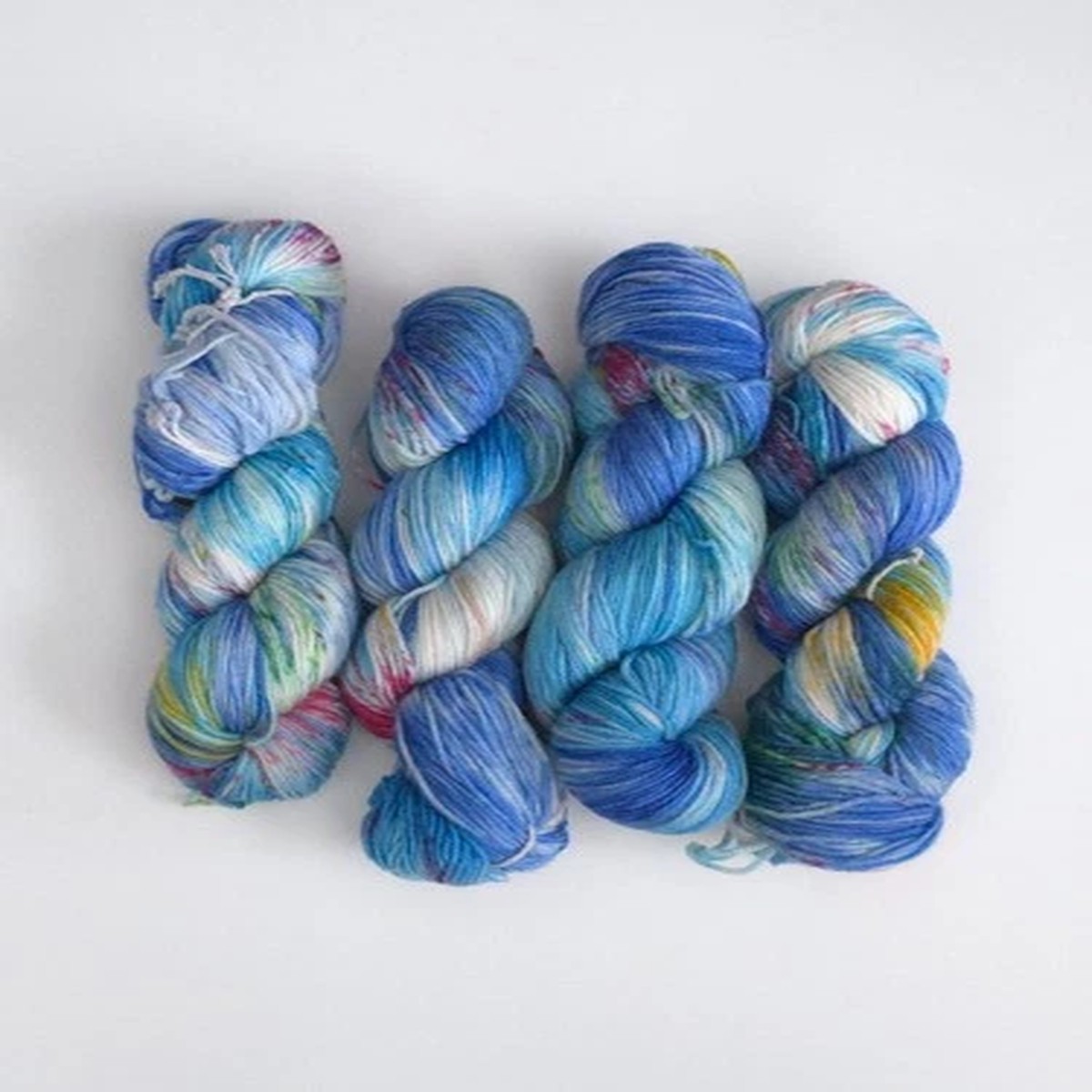 artisan-indie-hand-dyed-merino-wool-sport-yarn-ocean-blue-red-speckled-100g