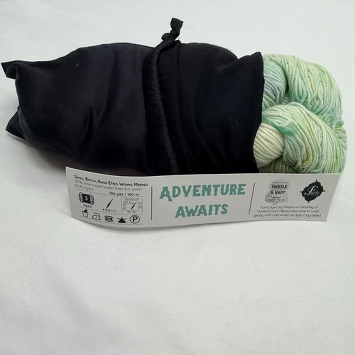 furls-whims-merino-yarn-adventure-awaits-hand-dyed-196-yds-furls-bag-y12-green