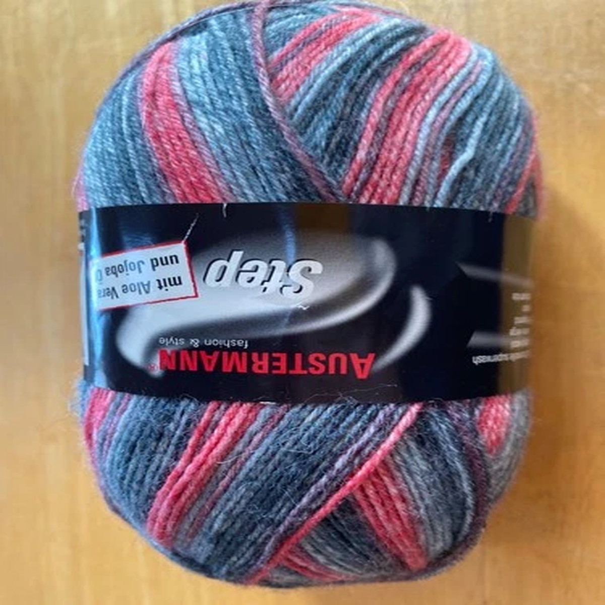 austermann-step-self-striping-yarn-color-red-gray-0018-459-yards