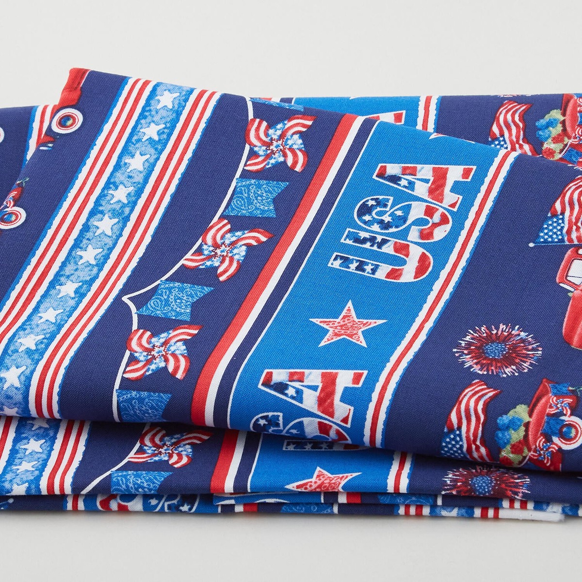 wings-of-freedom-border-stripe-blue-multi-2-yard-cut