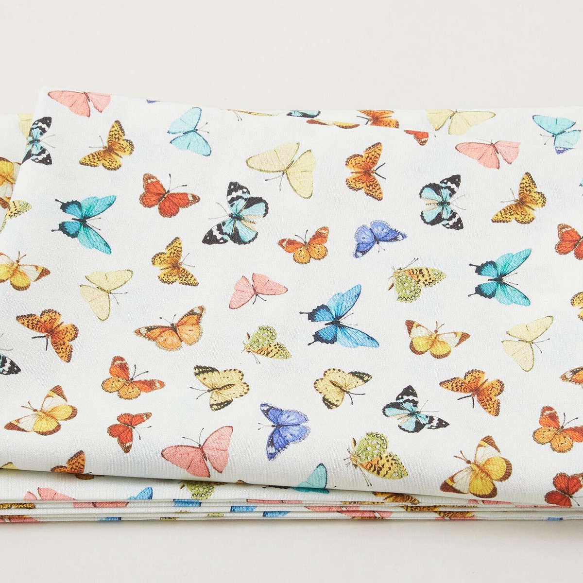 mediterranean-riviera-lots-of-butterflies-cream-2-yard-cut