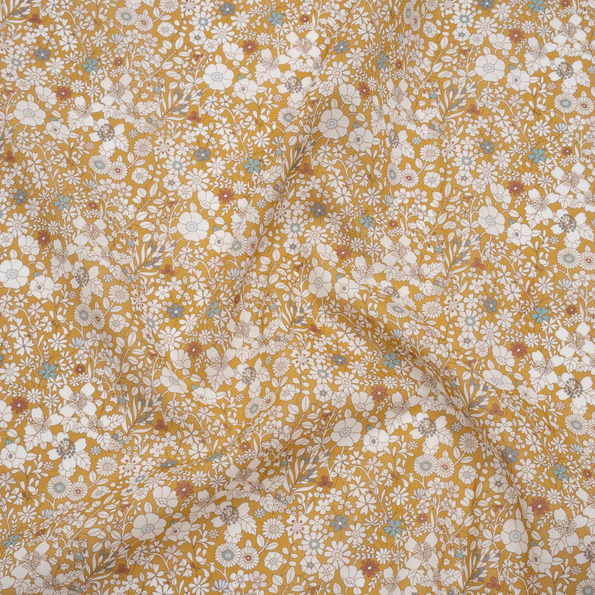 liberty-fabrics-tana-lawn-june-s-meadow-yellow-ochre-white-and-light-blue-illustrated-flowers