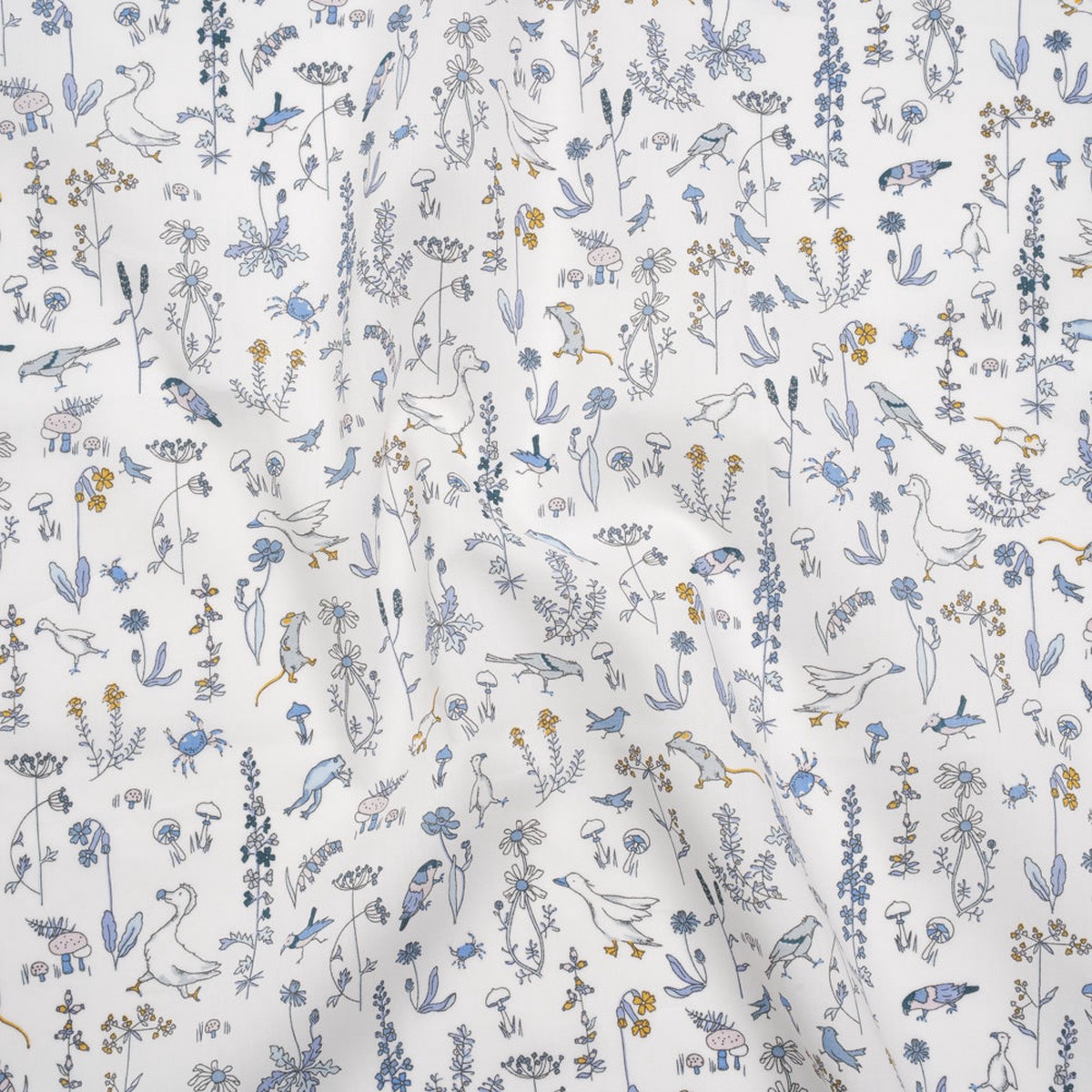 liberty-fabrics-tana-lawn-theo-blue-baby-blue-yellow-and-white-cartoon-creatures-and-flowers